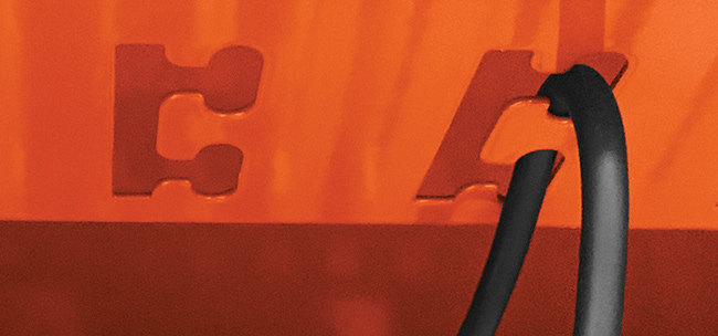 Bretford's cord management system illustrated with a cord routed through a notched hook