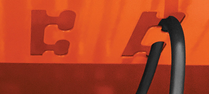 Bretford's cord management system illustrated with a cord routed through a notched hook