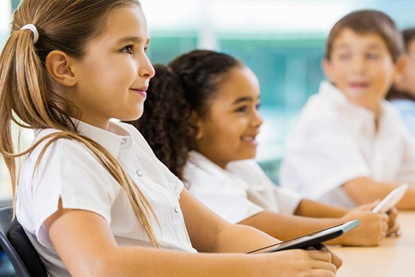 k12 children with tablet in classroom